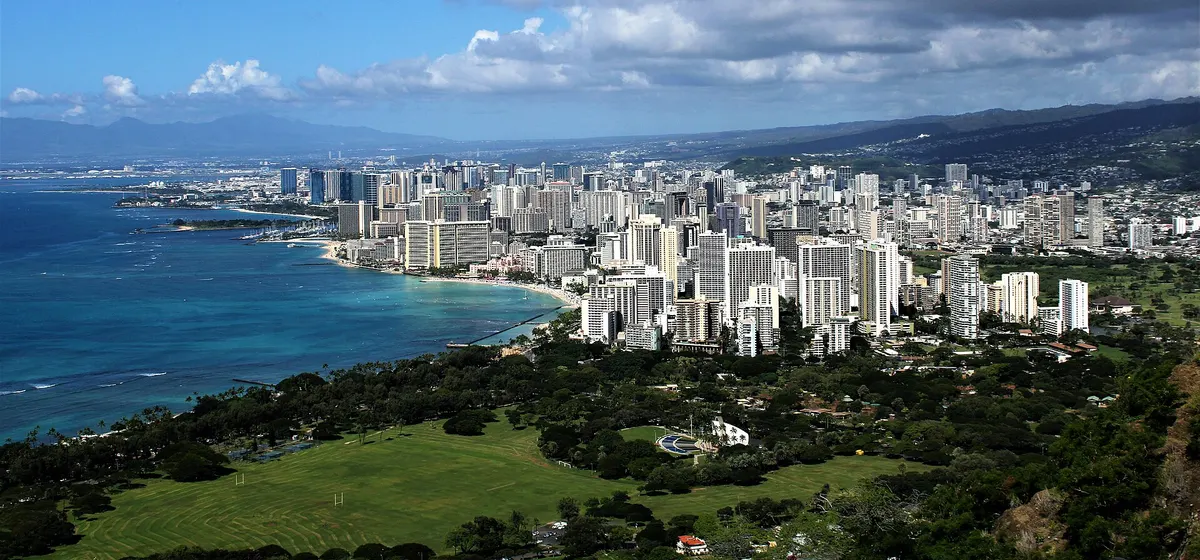 Waikiki's hotel towers and the Honolulu skyline along the shore, seen from the summit of Diamond Head