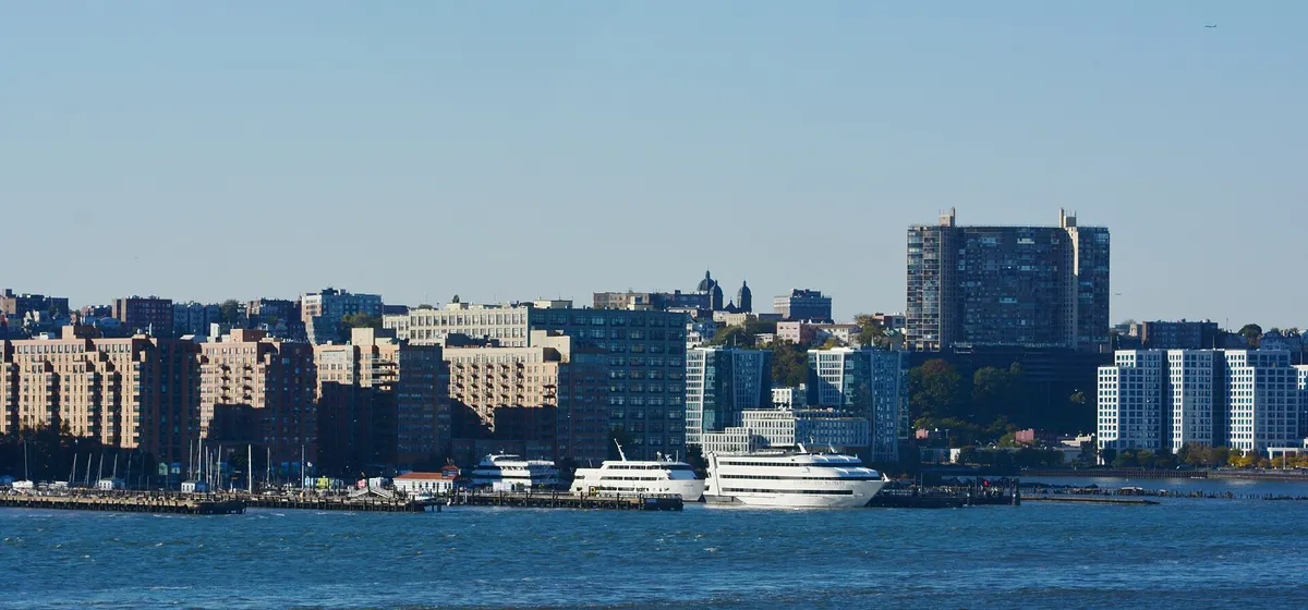 Hoboken's apartment blocks and ferry piers along the Hudson River, seen from Manhattan