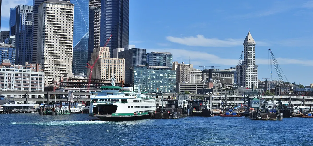 Downtown Seattle's towers above the waterfront, seen from a Washington State ferry on Elliott Bay with another ferry at the dock